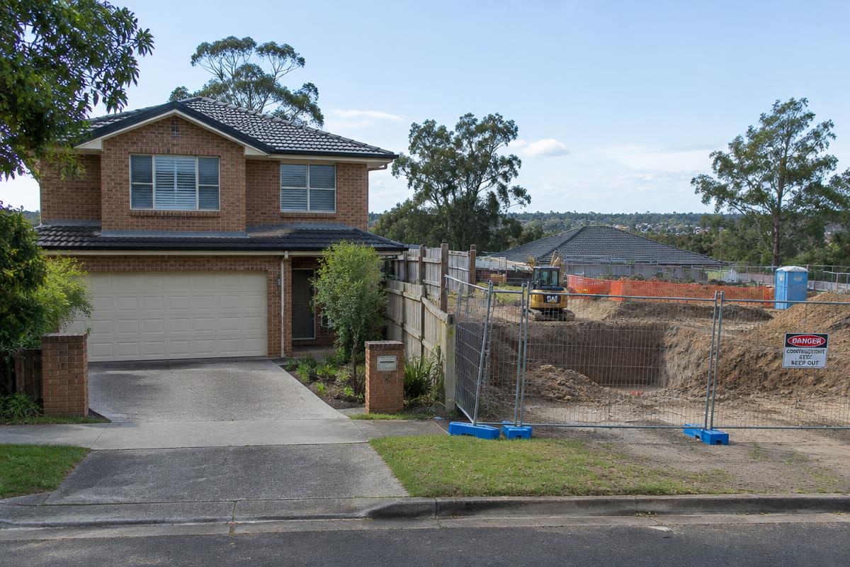 Brick home beside an excavation site (illustrative image)